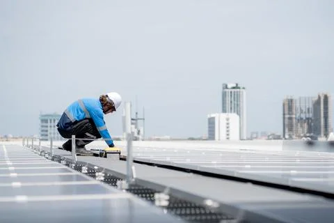 Engineer inspection solar panel installation on rooftop, checking photovolt.. 写真素材