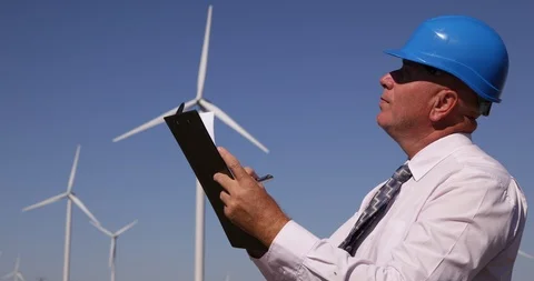 Engineer Inspection in Wind Turbines Location Take Notes in a Clipboard Document Stock-Footage 103251739