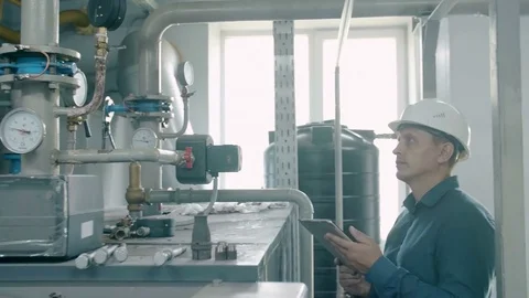 Engineer inspects the gas boiler Stock Footage 80364427