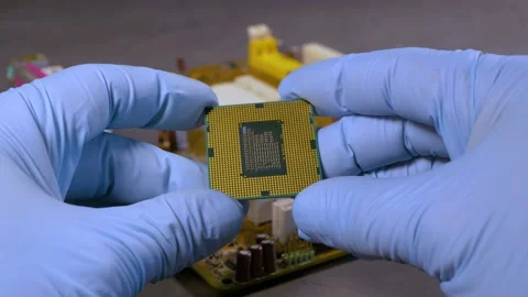 An engineer inspects a processor die for damage. Close-up, selective focus. Stock Footage 201933248