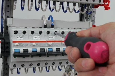 The engineer installs automatic protection. Stock Photos