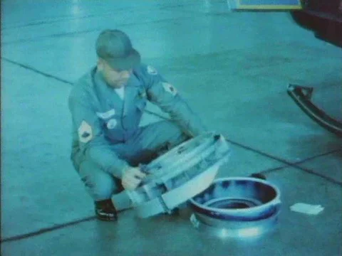 An engineer installs a prototype on a helicopter and it is taken out for a test Stock Footage 75184580