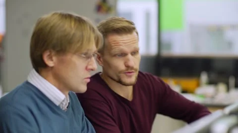 Engineer joining colleague to discuss project Stock Footage 142163064