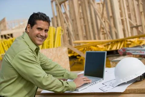 Engineer With Laptop At Construction Site Stock Photos