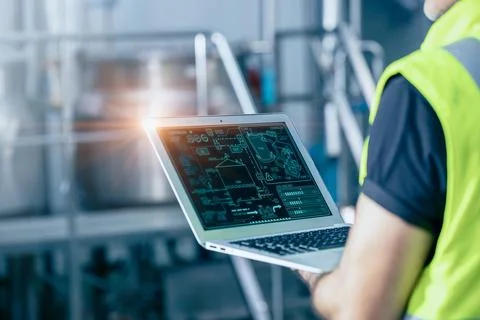 Engineer with laptop high technology software for industrial factory automa.. Stock Photos
