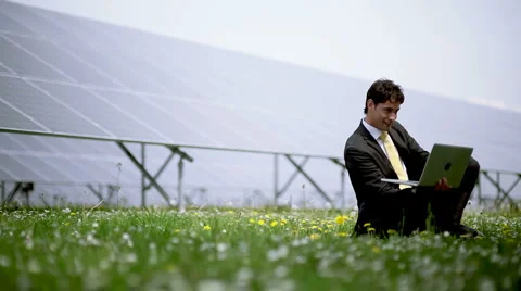 Engineer on laptop at solar power station Stock Footage 3536829