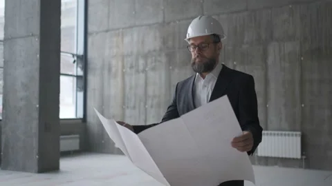 Engineer Looking At Building Plans In Construction Site. Stock Footage 106874888