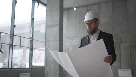 Engineer Looking At Building Plans In Construction Site. Stock Footage 106875447
