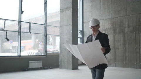 Engineer Looking At Building Plans In Construction Site. Stock Footage 106992261