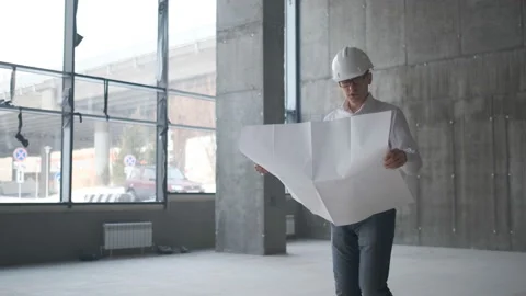Engineer Looking At Building Plans In Construction Site. Stock Footage 106992906