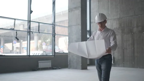 Engineer Looking At Building Plans In Construction Site. Stock Footage 107077106