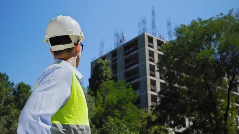 Engineer Looking At Building Plans In Construction Site. Architect or engineer Stock Footage 114896855