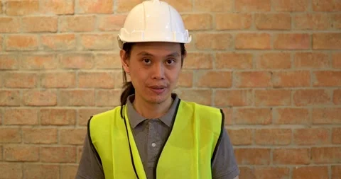 Engineer looking on camera, VDO conference meeting, architect inspector Stock Footage 133905750