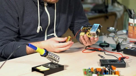 Engineer looking at a circuit board. Stock Footage 68849060