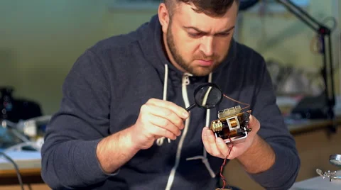 Engineer looking at a circuit board. Stock Footage 68851408