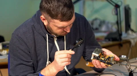Engineer looking at a circuit board. Stock Footage 69031302