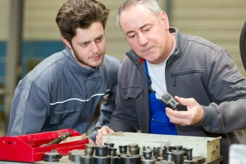 Engineer looking for the correct sized tool Stock Photos
