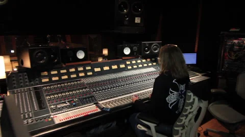 Engineer looking in on drummer Stock Footage 52699256