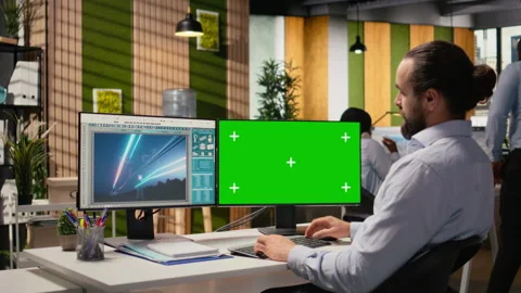 Engineer looking at power lines analytics dashboard on isolated screen PC Stock Footage 316004637