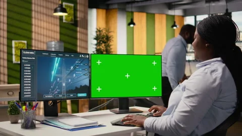 Engineer looking at power lines analytics dashboard on isolated screen PC Stock Footage 316006134