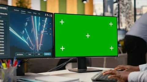 Engineer looking at power lines analytics dashboard on isolated screen PC Foto stock