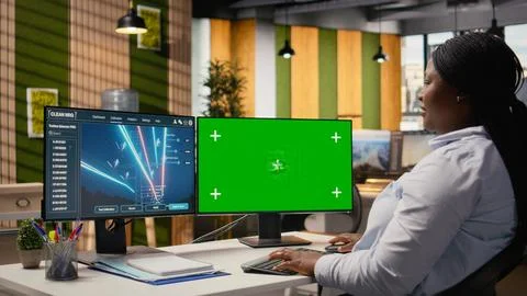 Engineer looking at power lines analytics dashboard on isolated screen PC Stock Photos