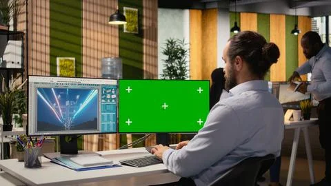 Engineer looking at power lines analytics dashboard on isolated screen PC Stock Photos