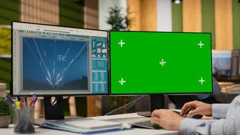 Engineer looking at power lines analytics dashboard on isolated screen PC Stock Photos