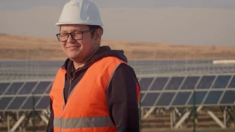 The engineer looks at the camera, puts his hands on his chest and smiling looks Stock Footage 103461064