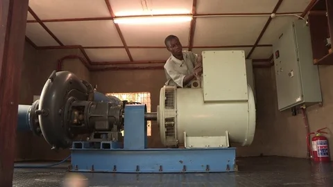 Engineer maintaining a hydro power generator Stock-Footage 84716802