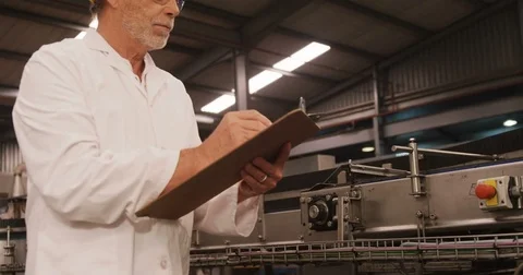 Engineer maintaining record in clipboard Stock Footage