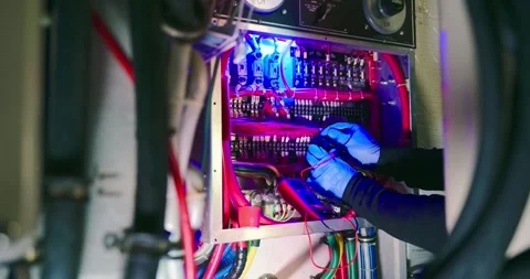 Engineer Maintains Machinery in Engine Room Stock Footage 323750222