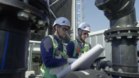 Engineer maintenance hvac cooling tower technician blueprint hard hat safet.. Stock Footage 335192200