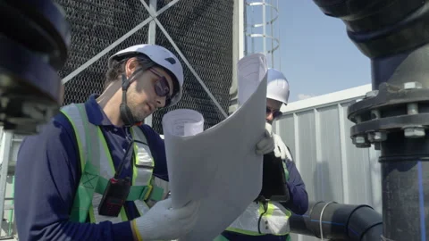 Engineer maintenance hvac cooling tower technician blueprint safety inspect.. Stock Footage 335192216