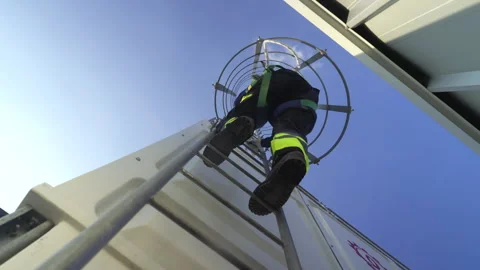Engineer maintenance hvac cooling tower safety harness ladder rooftop inspe.. Stock Footage 335192841
