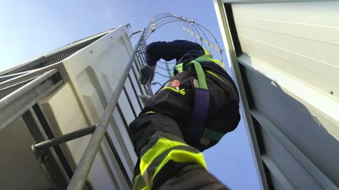Engineer maintenance hvac cooling tower ladder rooftop safety harness worke.. Stock Footage 335193628