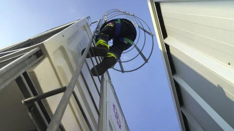 Engineer maintenance hvac cooling tower worker ladder safety harness indust.. Stock Footage 335193753