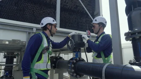 Engineer maintenance hvac cooling tower technician industrial valve work on.. Stock Footage 335193937