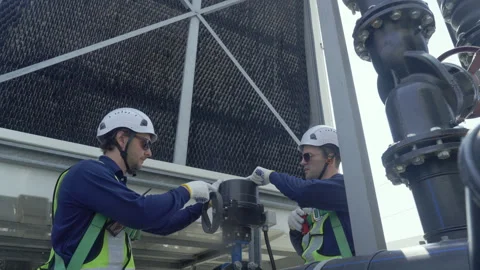 Engineer maintenance hvac cooling tower technician repair industrial pipe v.. Stock Footage 335194263
