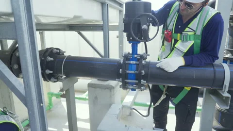 Engineer maintenance hvac cooling tower valve pipe safety rooftop actuator .. Stock Footage 335194277