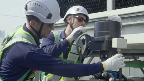 Engineer maintenance hvac cooling tower technician safety helmet valve insp.. Stock Footage 335194325