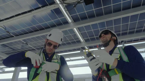 Engineer maintenance solar panel inspection technician rooftop safety tool .. Stock Footage 335192197