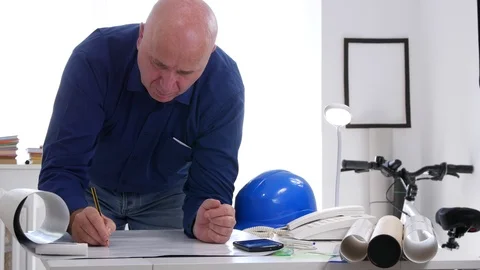 Engineer Make Calculation with Adding Machine and Change the Project Stock Footage 97714865