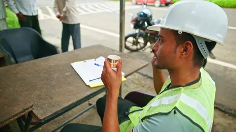 Engineer makes call during rest time Stock Footage 297601068