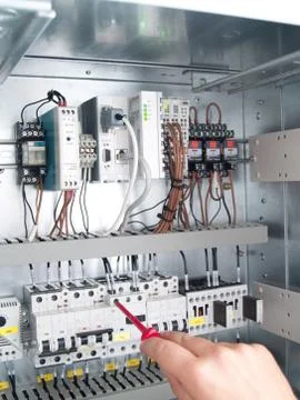 Engineer makes maintenance of power network automation Stock Photos