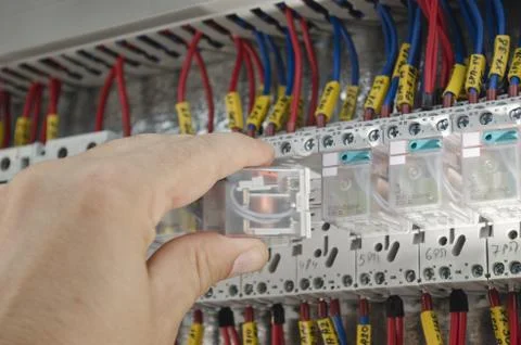 Engineer makes maintenance of power network automation Stock Photos