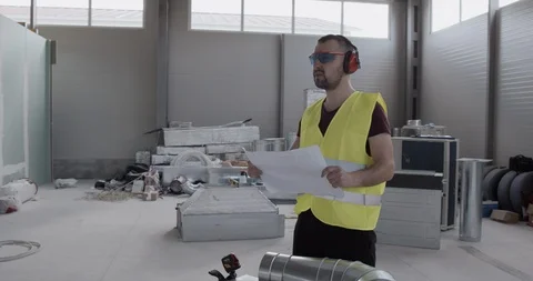 The engineer makes notes in the notebook and checks the quality of the works. Stock Footage 127204601