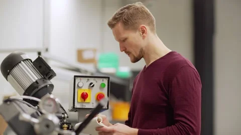 Engineer making notes near cnc machine in lab Video stock 142160967
