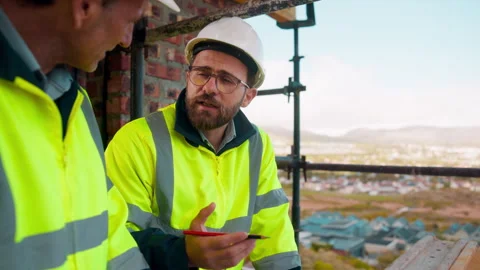 Engineer, man and discussion on construction site for planning, update and urban Stock Footage 336200550