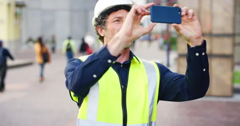 Engineer, man and phone outdoor with photography, urban development and Stock Footage 334537784